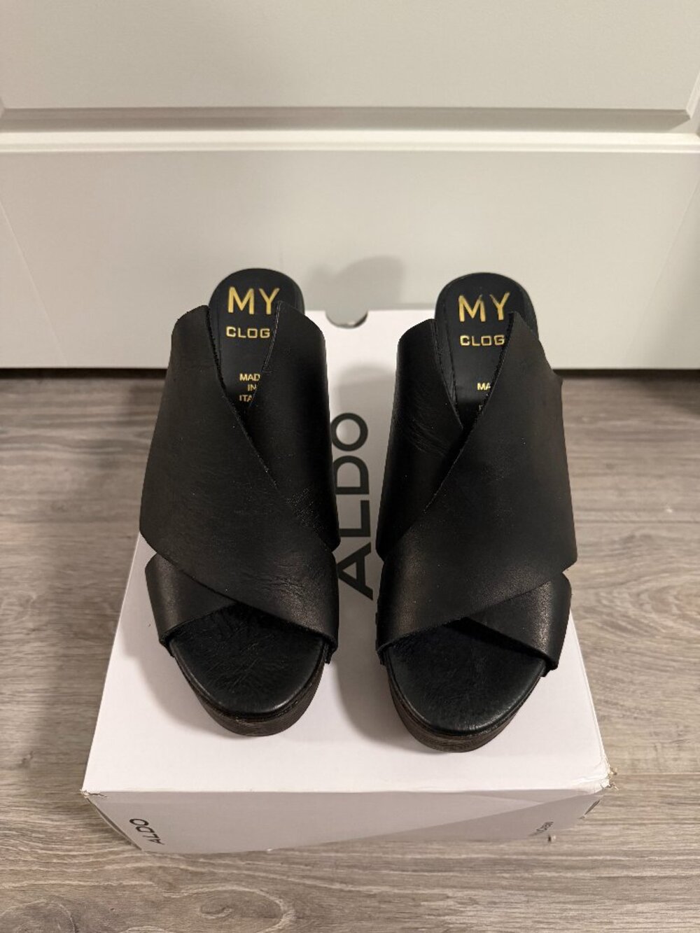Black high-heeled clogs